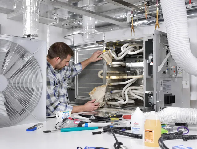 Sharon Air Duct Cleaning specialist performing precision AC coil cleaning in Sharon