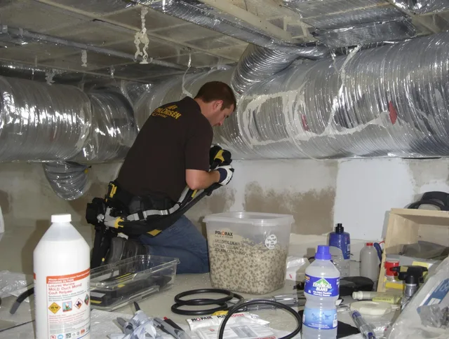Sharon Air Duct Cleaning specialist performing professional mold removal from air ducts in Sharon