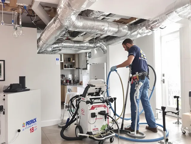 Sharon Air Duct Cleaning technician performing advanced pure duct cleaning with specialized equipment in Sharon