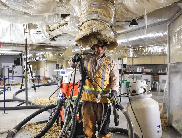 Professional vacuum insulation removal by Sharon Air Duct Cleaning expert in Sharon